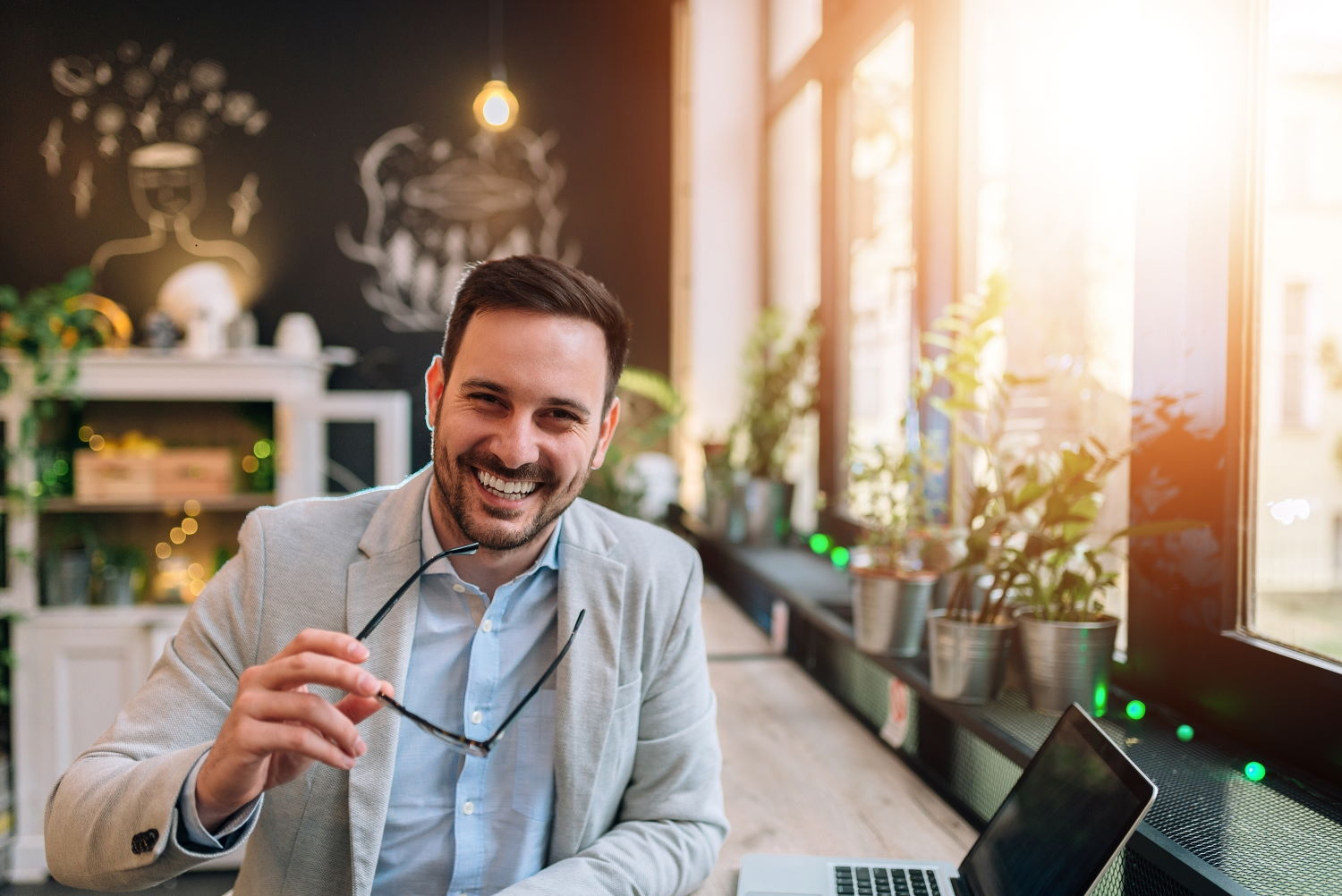 This is image of a smiling and lit up business coach